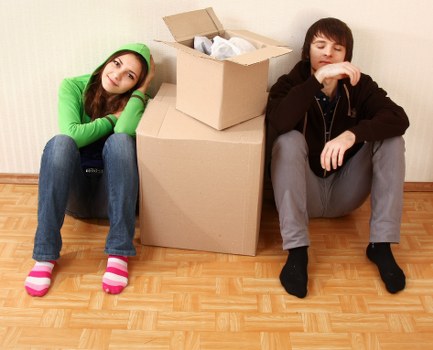 Professional movers handling office equipment